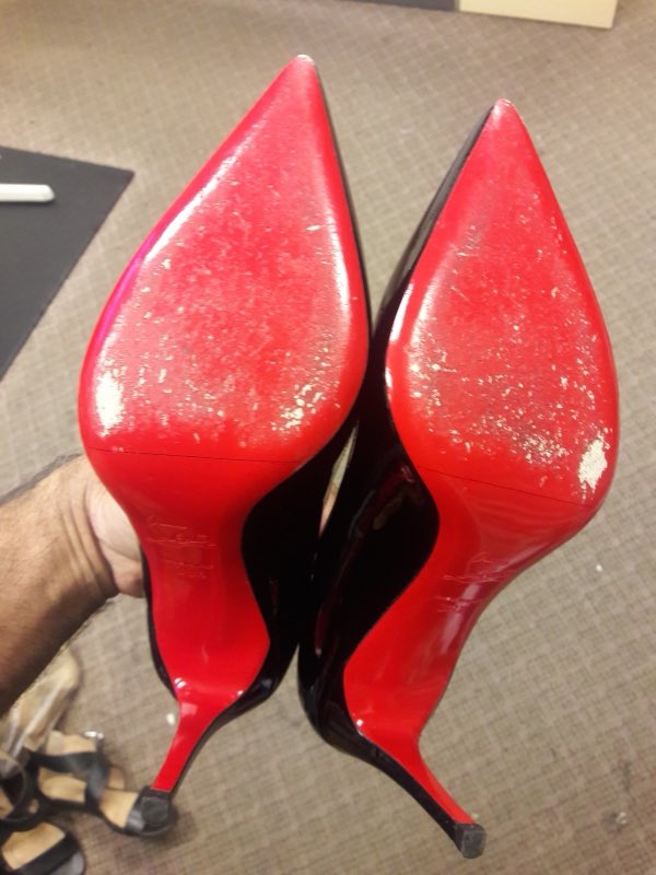Pointed heels with freshly restored red soles
